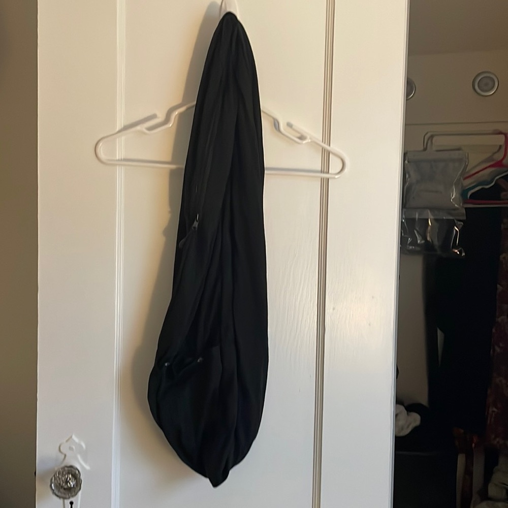 Black scarf with zip and button pocket. Excellent condition.